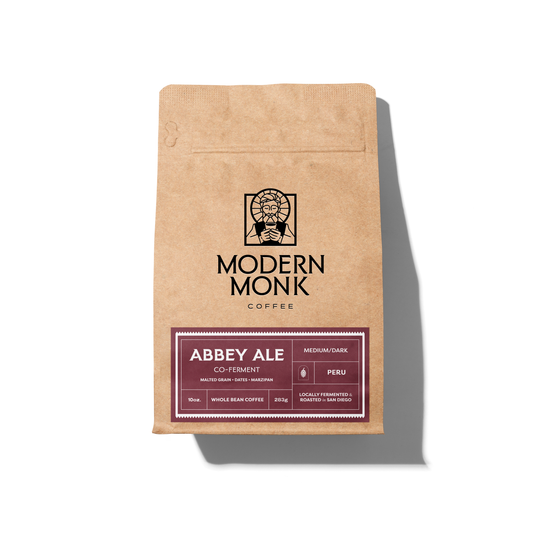 Kraft paper coffee bag with 'Modern Monk Coffee' branding on a white background